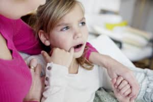 Child pointing at tooth image
